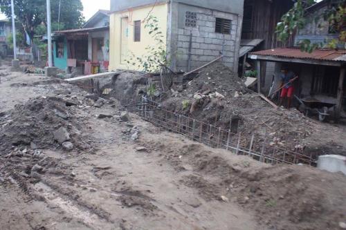 Inspecting the ongoing upgrading of road and construction of drainage system  (1)