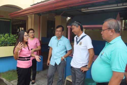 Inspecting the ongoing upgrading of road and construction of drainage system  (6)
